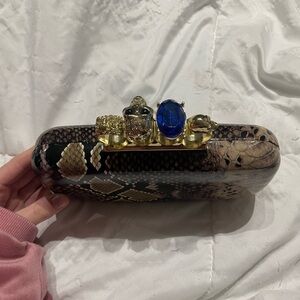 Elegant Snake Print Clutch with Gold Accents